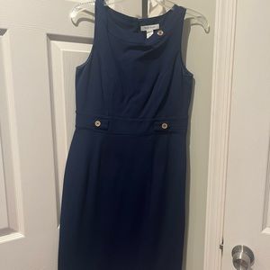 Simple conservative navy knee length dress.